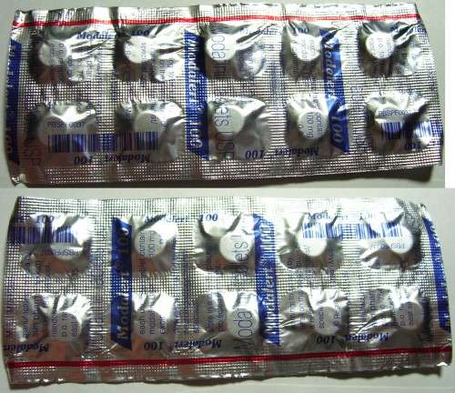 The front of 1 10x100mg strip, and rotated