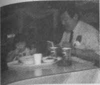 Takeda takes a quick break and eats with Yukino.