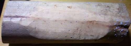 The Mark 2 wooden pillow, paint-spattered years later after use in random projects