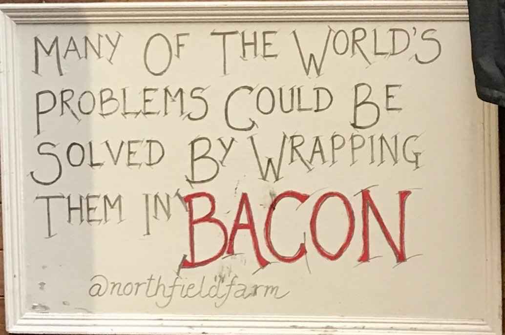 Hand-drawn sign advertising Northfield Farm’s bacon, photo Twitter 2019