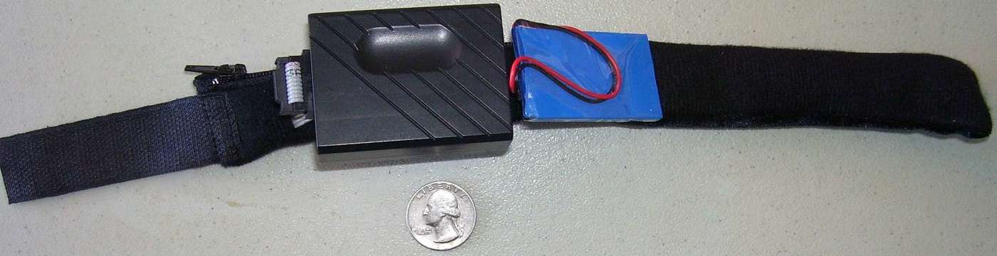 A North Paw laid out flat, with control box and battery pack visible